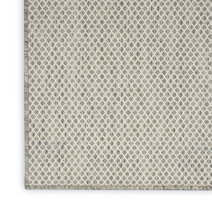 6' X 9' Ivory and Silver Indoor Outdoor Area Rug
