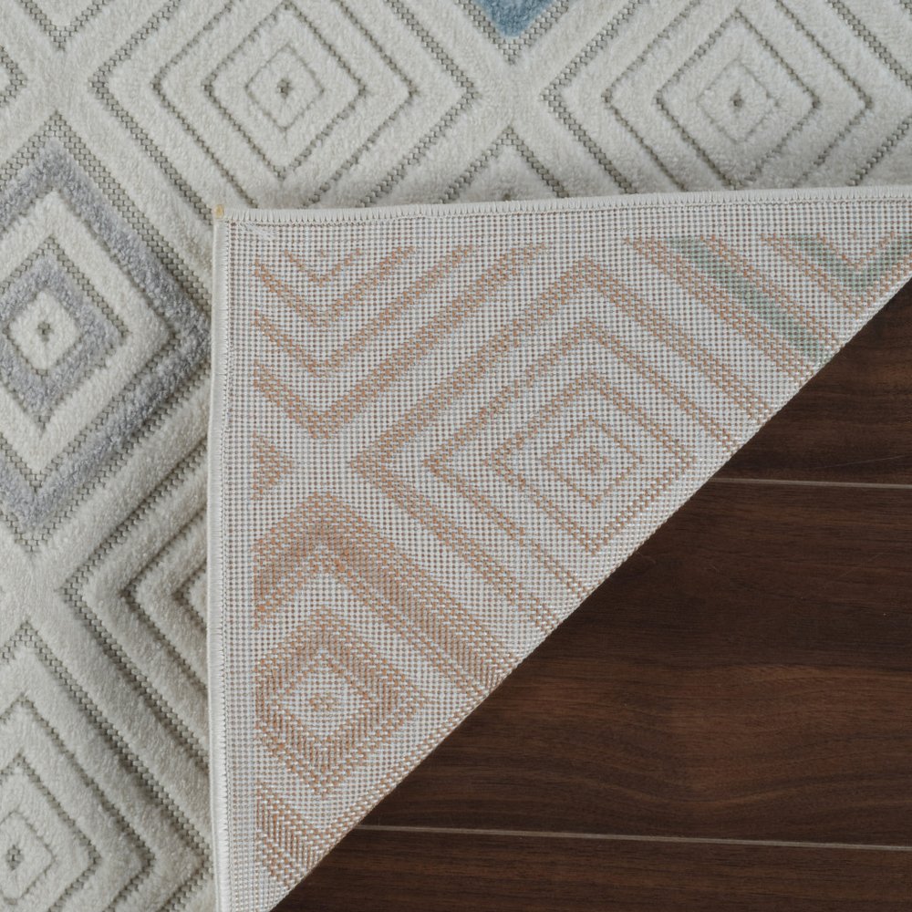 5' X 7' Cream and Beige Geometric Distressed Indoor Outdoor Area Rug