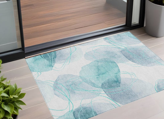 2' X 3' Teal and Ivory Abstract Washable Non Skid Indoor Outdoor Area Rug