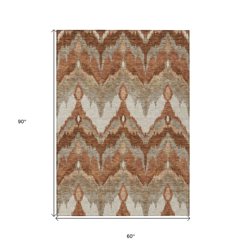 3' X 5' Orange Beige And Copper Ikat Washable Indoor Outdoor Area Rug