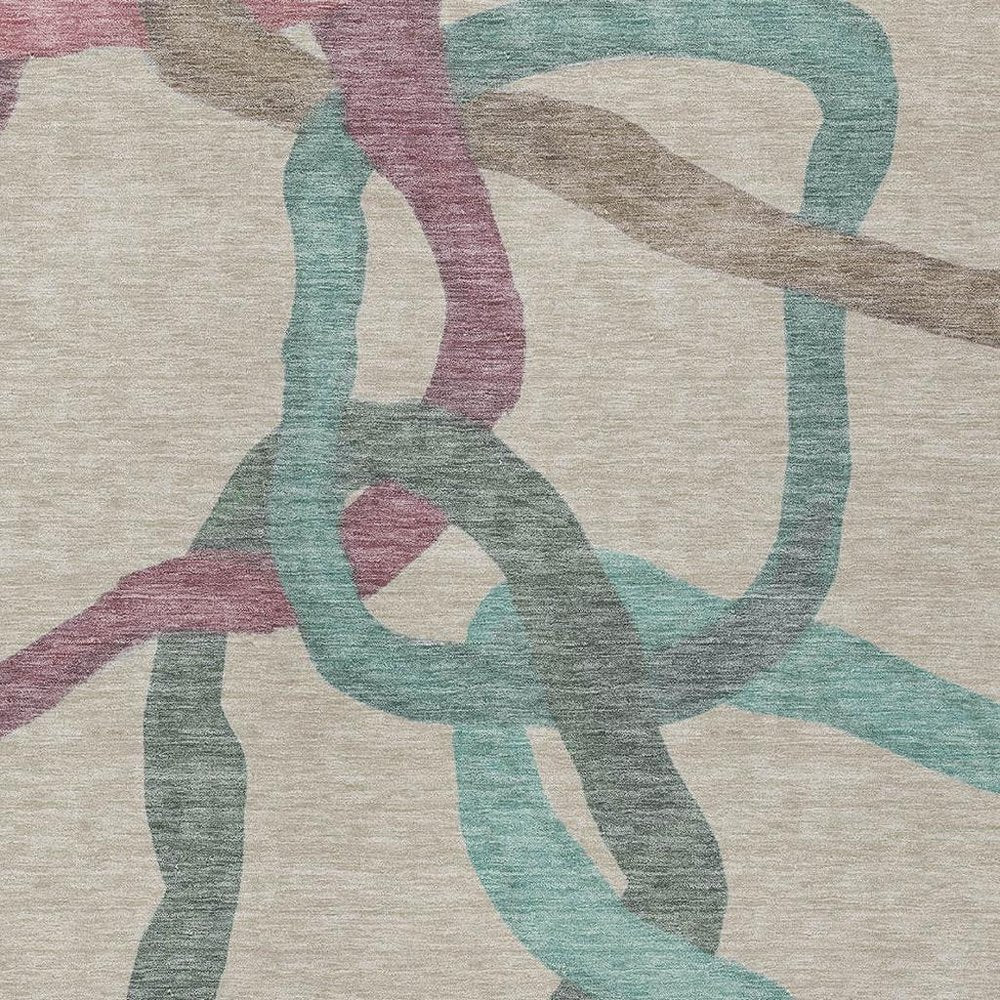 9' X 12' Tan Blue And Mauve Abstract Washable Indoor Outdoor Area Rug