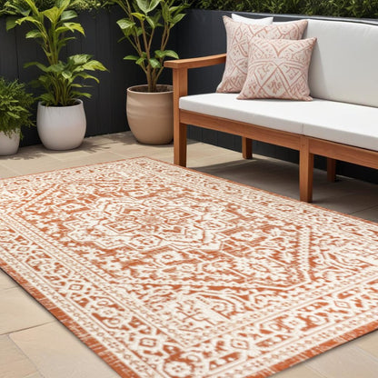 8' X 10' Orange And Cream Medallion Indoor Outdoor Area Rug