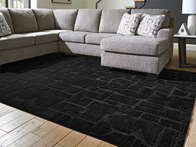 Evee Outdoor & More - Ashley Furniture - Gibbswell Rug - Washable 5' x 7' Area Rug / Black - R407462