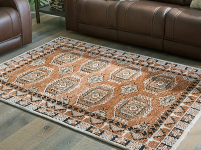 Evee Outdoor & More - Ashley Furniture - Qaabiz Rug - 5' x 7' Area Rug / Sienna/Ivory/Black - R407522