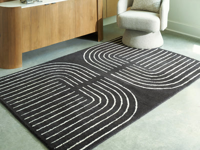 Evee Outdoor & More - Ashley Furniture - Eldonmore Rug - 5' x 7' Area Rug / Black/Ivory - R407572