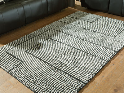 Evee Outdoor & More - Ashley Furniture - Kurtmen Rug - 5' x 7' Area Rug / Black/Ivory - R407592